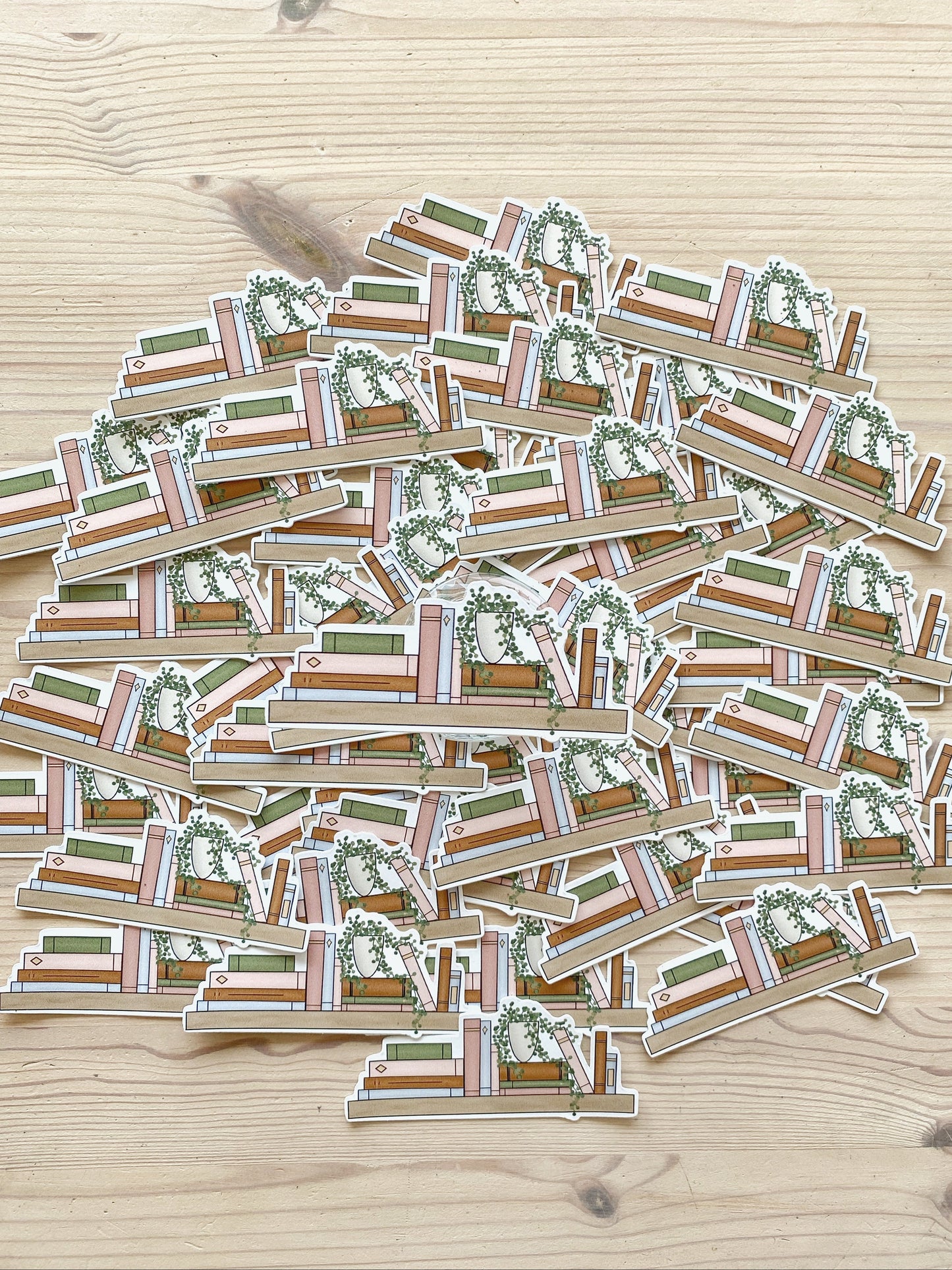 A variety of bookshelf decorative stickers are spread on a tabletop showcasing the product.