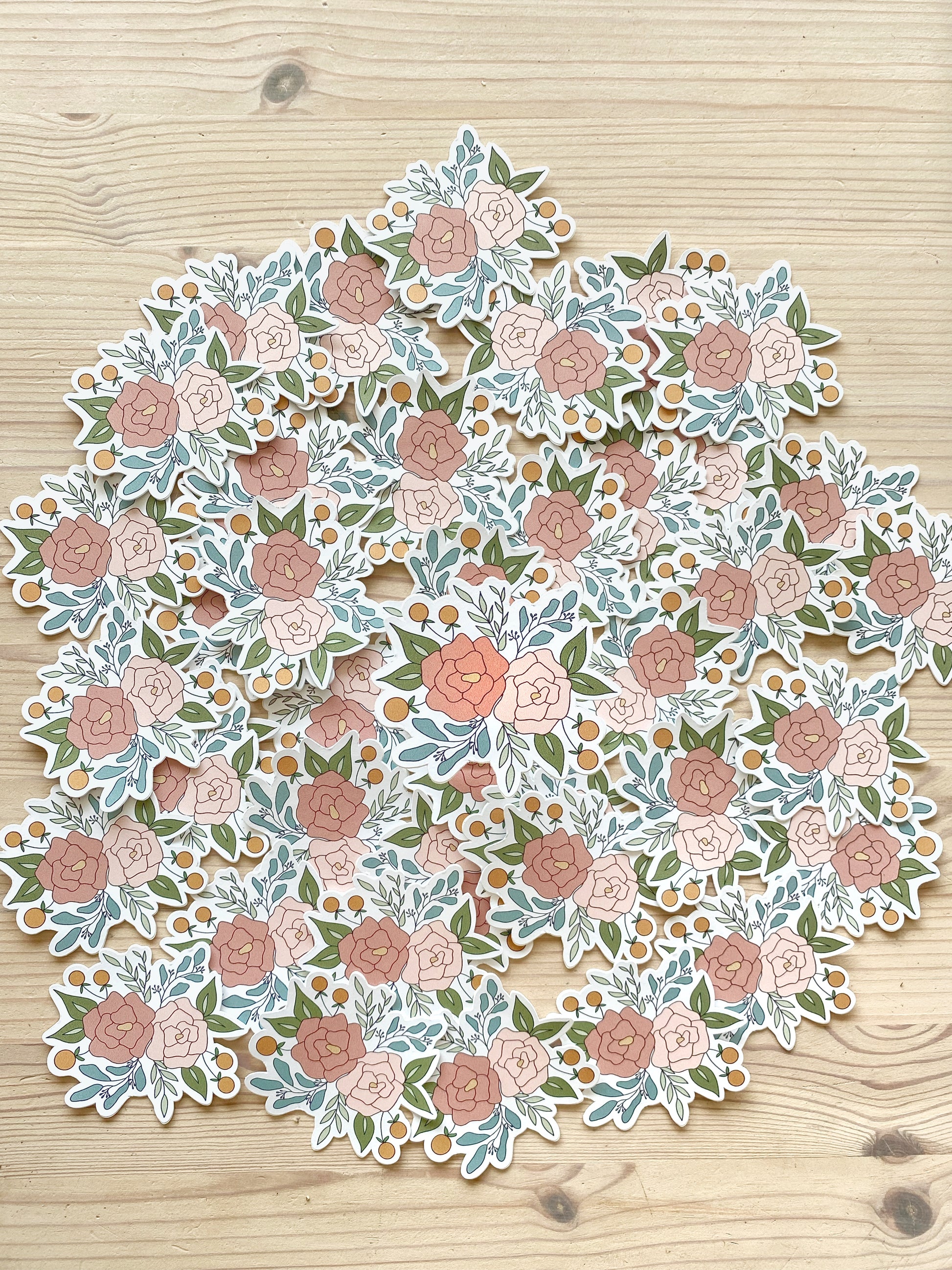 A product photo featuring a floral arrangement sticker.